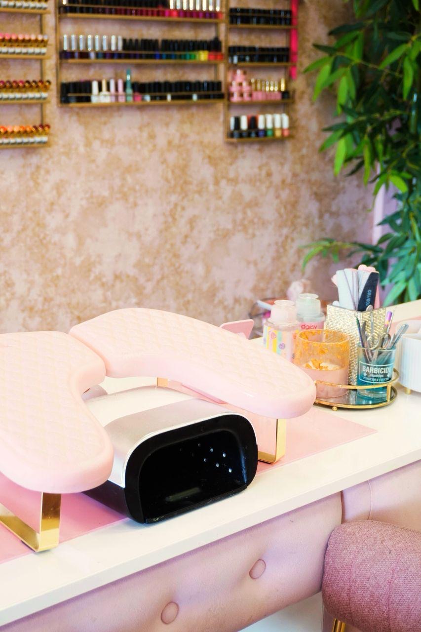 A pink manicure station ready for a nail appointment